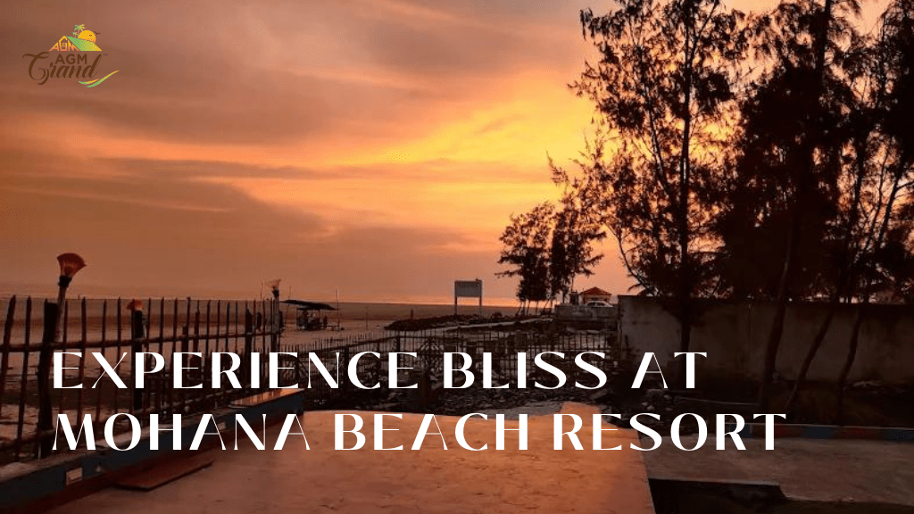 A photo of a sunset at a beach resort in Mandarmani, West Bengal, India. The resort is called Mohana Beach Resort, and it is located on a stretch of white sand beach. The sky is ablaze with orange and pink hues, and the water is a deep blue. The text "Mohana Beach Resort: Experience Bliss at the Beach" is visible in the image.