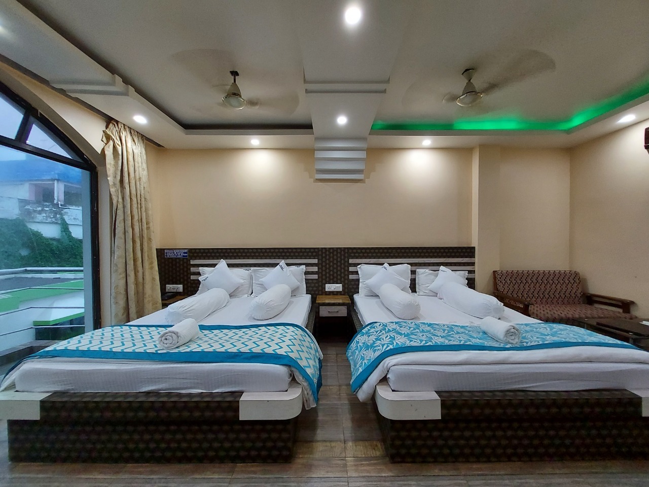 A spacious and luxurious four-bedroom balcony room with a scenic view at Mohana Beach Resort in Mandarmani, West Bengal, featuring comfortable accommodations and a beautiful seaside setting.